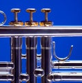 Silver Trumpet Isolated on Blue Royalty Free Stock Photo