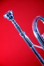 Silver Trumpet Isolated On Red Royalty Free Stock Photo