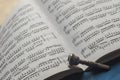 Silver Trumpet mouthpiece on sheet music book Royalty Free Stock Photo