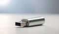 Silver USB flash drive with USBA connector on a light surface with blurred background Royalty Free Stock Photo