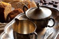 Silver utensil, bread and cocoa