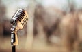 Silver vintage microphone in the studio on outdoor background