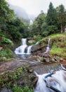 Silver waterfall or Thac Bac on fog in rainy season Royalty Free Stock Photo