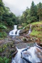 Silver waterfall or Thac Bac on fog in rainy season Royalty Free Stock Photo