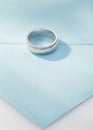 Silver Wedding Ring With Diamonds On Blue Background