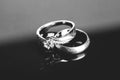 silver wedding rings, diamond ring on black background Royalty Free Stock Photo