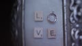 Silver Wedding Rings on the wall with love macro closeup shoot diamon Jewellery