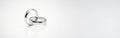 Silver wedding rings on white background highlighting unity and commitment in marriage. concept of love, partnership, wedding Royalty Free Stock Photo