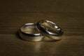 Silver Wedding Rings on a wooden background Royalty Free Stock Photo