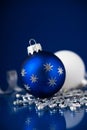 Silver, white and blue christmas ornaments on dark blue background. Merry christmas card. Royalty Free Stock Photo