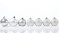 Silver and white christmas baubles with snow on white background Generative AI Royalty Free Stock Photo