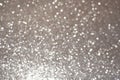 Silver white glittering Christmas lights. Blurred abstract background Royalty Free Stock Photo