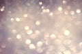 Silver white glittering Christmas lights. Blurred abstract holiday background