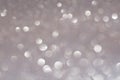 Silver white glittering Christmas lights. Blurred abstract holiday background Royalty Free Stock Photo