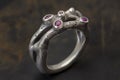 Silver or white gold cocktail ring with pink sapphires closeup. Precious gems and metals, natural gemstone jewelry Royalty Free Stock Photo