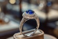 Silver or white gold ring with diamonds and blue sapphires closeup. Precious gems and metals, natural gemstone jewelry Royalty Free Stock Photo