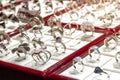 Silver or white gold rings with diamonds and other gemstones jewelry on display jewelry market. Selective focus