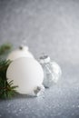 Silver and white xmas ornaments on glitter holiday background. Merry christmas card. Royalty Free Stock Photo