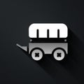 Silver Wild west covered wagon icon isolated on black background. Long shadow style. Vector Royalty Free Stock Photo