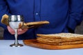 Silver wine cup with matzah, Jewish symbols for the Passover Pesach holiday. Passover concept.