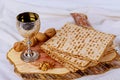 Silver wine cup with matzah, Jewish symbols for the Passover Pesach holiday. Passover concept.