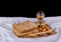 Silver wine cup with matzah, Jewish symbols for the Passover Pesach holiday. Passover concept