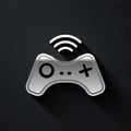 Silver Wireless gamepad icon isolated on black background. Game controller. Long shadow style. Vector Royalty Free Stock Photo