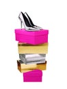 Silver Woman Shoes on top of stacked boxes isolated