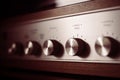 Silver wooden vintage amplifier: Close up of control knobs Royalty Free Stock Photo