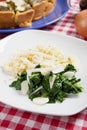 Silverbeet with noodles, garlic and grated cheese Royalty Free Stock Photo