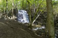 Silverfallet Staircase Waterfall illuminated by low rays of sun Royalty Free Stock Photo