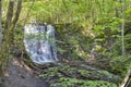 Silverfallet Staircase Waterfall illuminated by low rays of sun Royalty Free Stock Photo