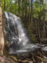 Silverfallet Staircase Waterfall illuminated by low rays of sun Royalty Free Stock Photo