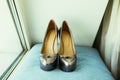 Silvering bride shoes on wedding day on blue pillow Royalty Free Stock Photo