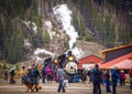 Narrow Gauge Steam Locomotive blowing steam in Silverton Co as tourists looking at train Royalty Free Stock Photo