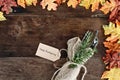 Silverware and Card over Wooden Background