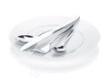 Silverware or flatware set of fork, spoons and knife over plates Royalty Free Stock Photo