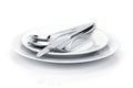 Silverware or flatware set of fork, spoons and knife on plates Royalty Free Stock Photo