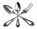 Silverware Flatware Set with Intricate Floral Detailing on White Background Royalty Free Stock Photo