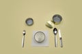 Silverware knife fork spoon napkin cans empty closed on yellow, cutlery