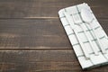 Silverware and napery on wooden background. Royalty Free Stock Photo