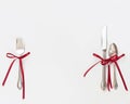 Silverware with Red Bows Royalty Free Stock Photo