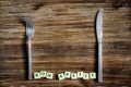 Silverware on the vintage table and Bon apetit sign