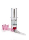 Silvery ampoules, small bottles, medical or cosmetic appointment and syringe