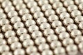 Silvery beads are interlaced together Royalty Free Stock Photo
