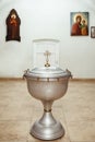 A silvery church font, decorated with gold elements Royalty Free Stock Photo