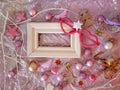 On silvery paper an empty wooden vintage frame, Christmas decor