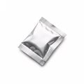 A silvery shiny foil packet with textured edges, isolated on a white Royalty Free Stock Photo
