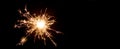 Silvester / New year background - Sparkling sparkler at dark night