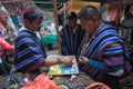 Guambiano men playing board game in Silvia, Colombia